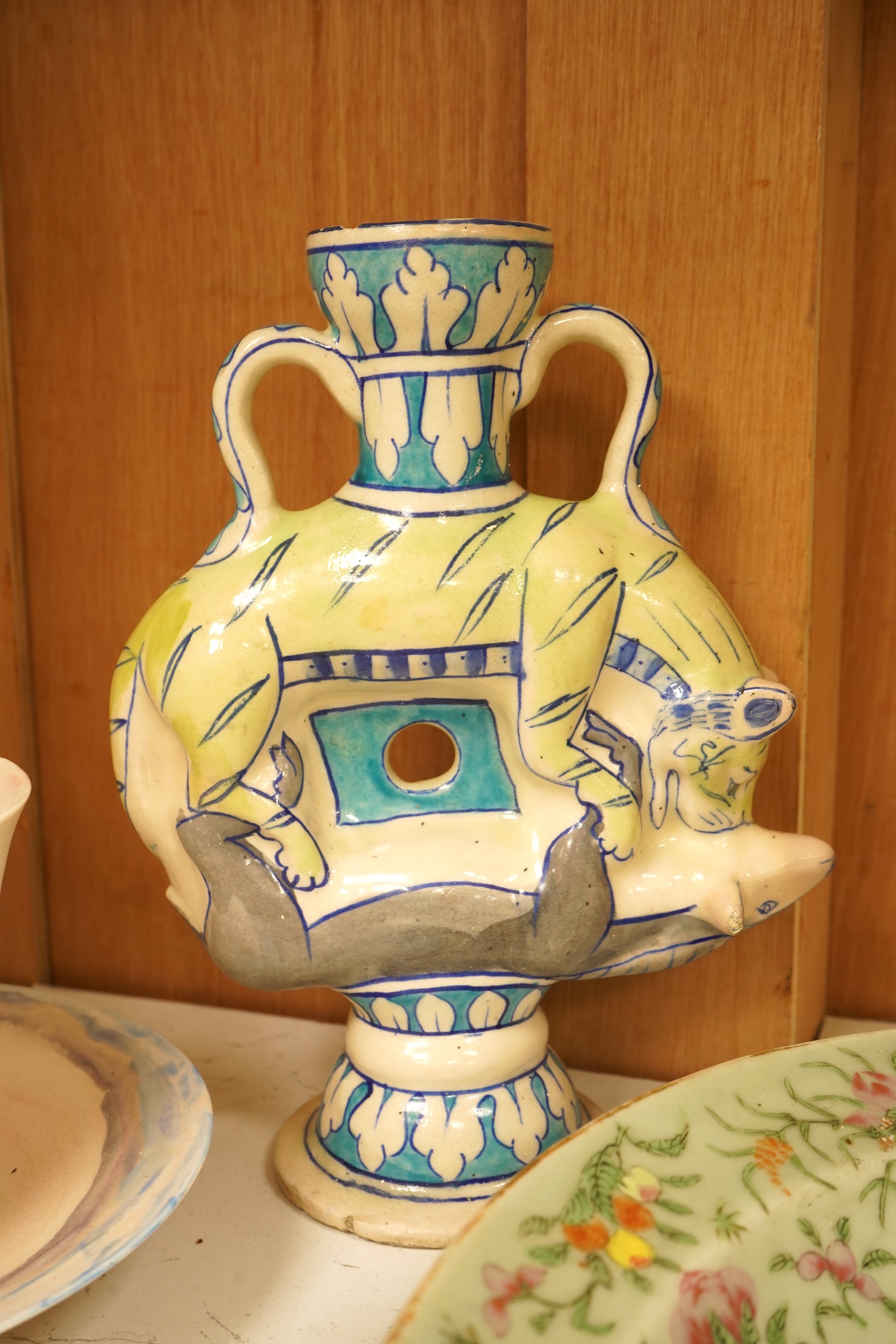 A mixed collection of European studio pottery to include a collection of four tall Italian candlesticks, tallest 58cm, two stoneware plates and a tureen and cover, etc.